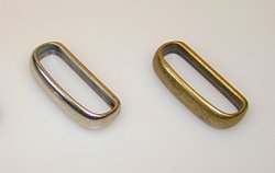 Belt loops in brass and silver colour