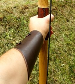 Medieval archery bracer in use
