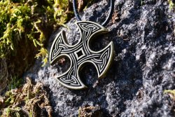 Celtic cross amulet in nature