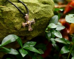 Medieval cross pendant in nature