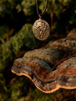 Viking gripping beast pendant