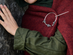 Viking thistle head brooch in use