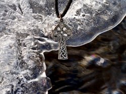 Celtic cross charm in nature