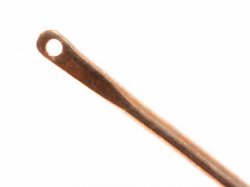 Medieval brass needle - head