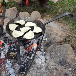 Medieval cooking trivet in use