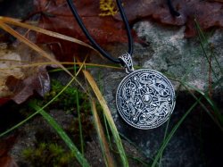 Viking disc charm in nature