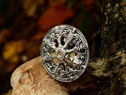 Viking disc brooch in nature